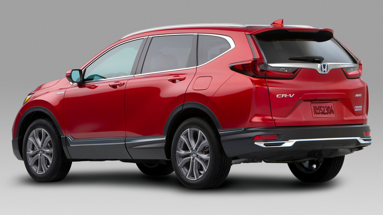 A red 2020 Honda CR-V Hybrid SUV against a gray background