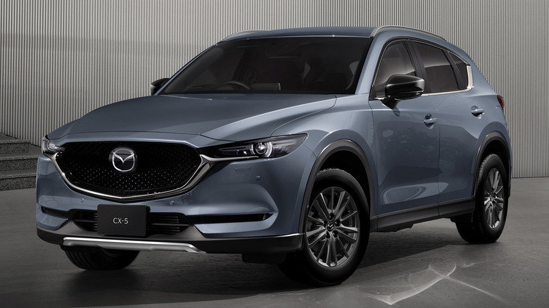 2017 Mazda CX-5 parked in front of stair and sleek looking modern building