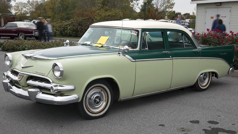 A two-tone green Dodge Coronet with a white roof and tail fins.