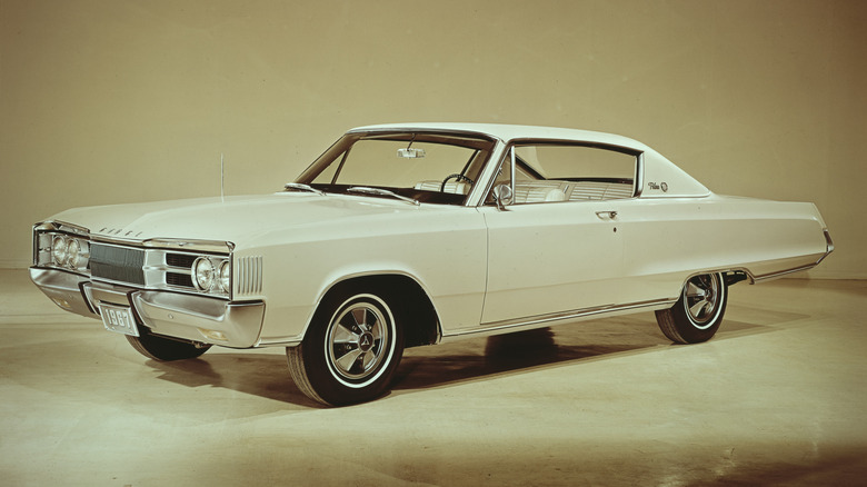 An all white Dodge Polara parked against an off-white background.