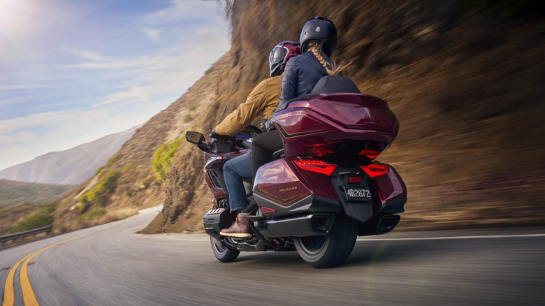 2025 Honda Goldwing cornering at speed rear 3/4 view