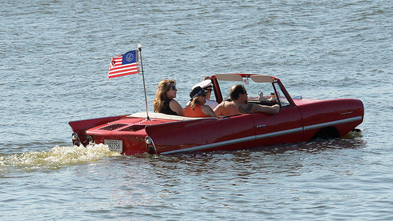 A ref Amphicar on water with passengers