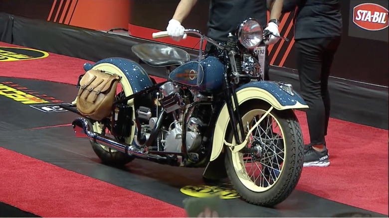 A 1936 Harley-Davidson EL Knucklehead for sale on the floor at Mecum Auctions in 2022.
