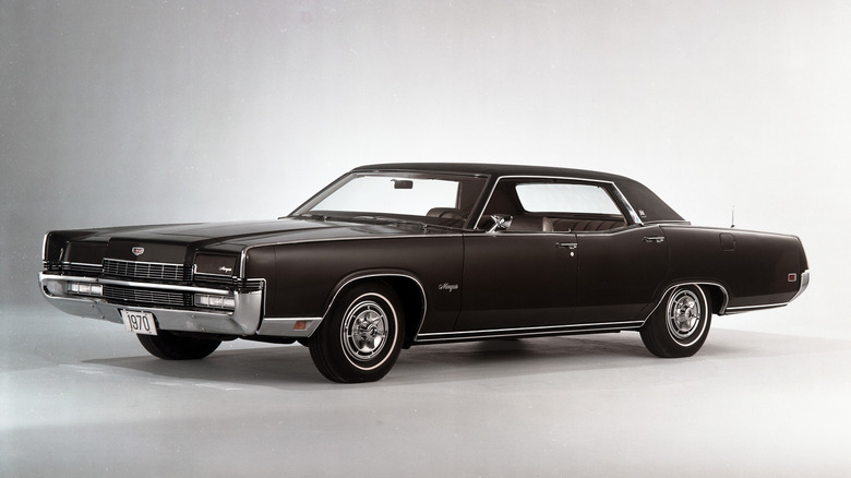 Black 1970 Mercury Marquis Brougham sedan seen from left front parked in studio