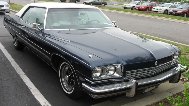 Blue 1973 Buick Electra coupe seen from front right in a parking lot