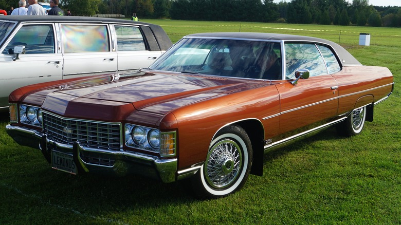 Bronze 1971 Chevrolet Caprice two-door seen from front left parked in a field