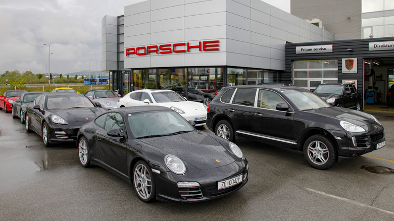 Row of Porsche Panamera models for sale on a lot