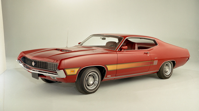 Red 1970 Ford Torino GT fastback coupe left front three-quarter view in studio