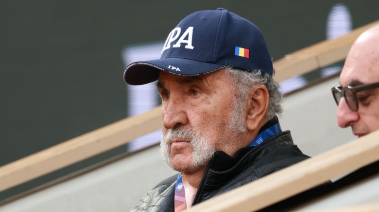 Ion Tiriac watching a bully game