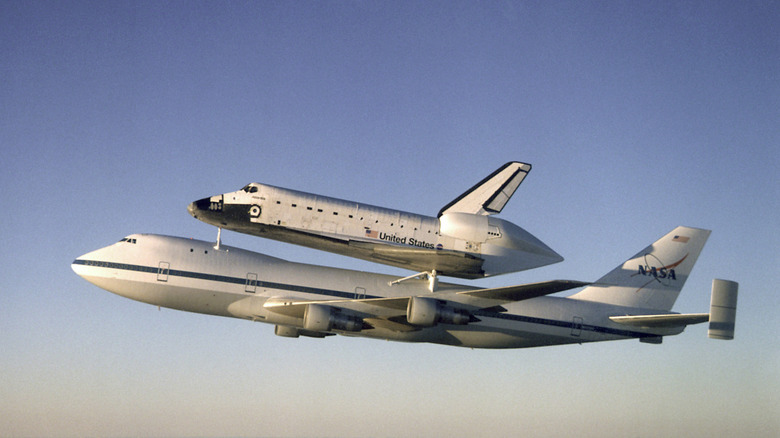 Boeing Shuttle Carrier Aircraft ferrying the Space Shuttle Atlantis seen from left in flight