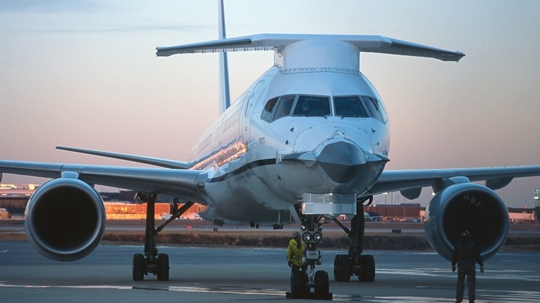 Boeing 757 Flying Test Bed aircraft seen from front parked in an airport at twilight