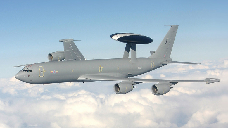 Boeing E-3 Sentry AWACS of British R.A.F. seen from left front in flight above clouds