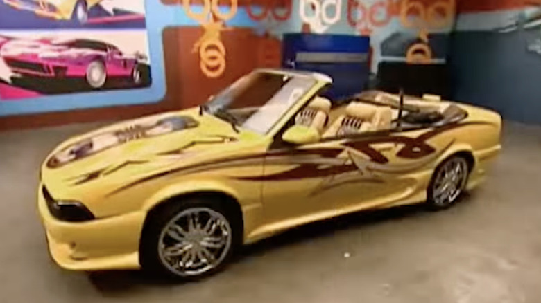 Esmeralda's yellow 1991 Pontiac Sunbird convertible inside GAS