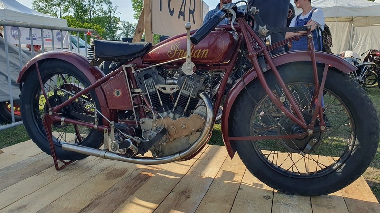 A red 1926 Indian Altoona A45 racing bike on display at a vintage bike show.