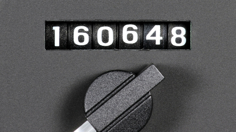 A close-up of an odometer showing high mileage.