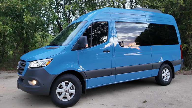 Front 3/4 of blue 2025 Mercedes-Benz Sprinter 12-passenger