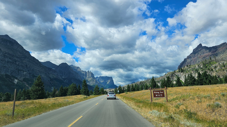 A picture of a road in Montana between two mountains.