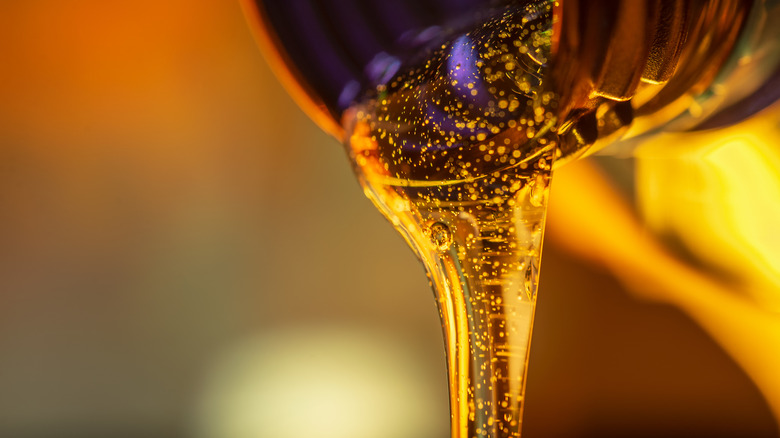 A viscous fluid pouring from a jug.