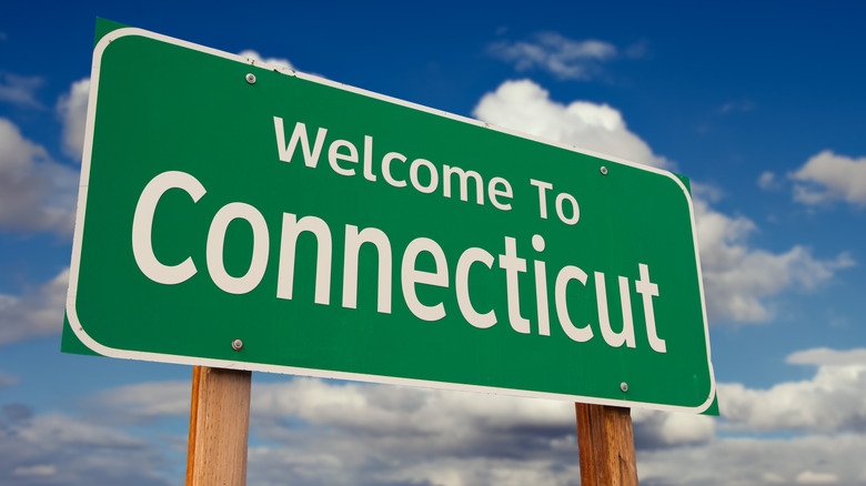 Connecticut welcome sign with blue sky and clouds