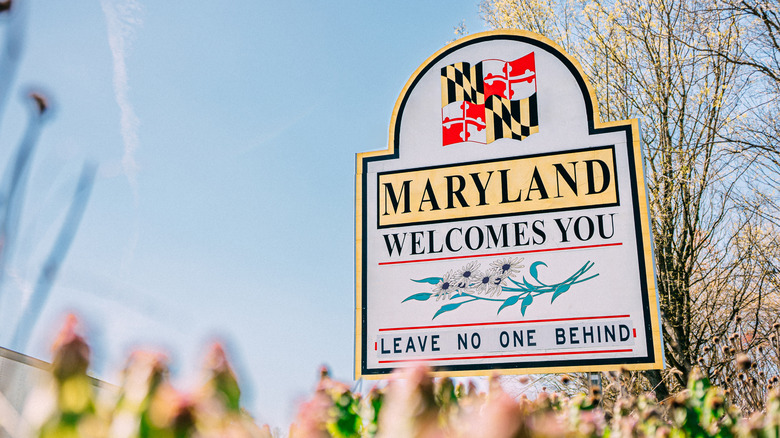 Maryland welcome sign that says leave no one behind