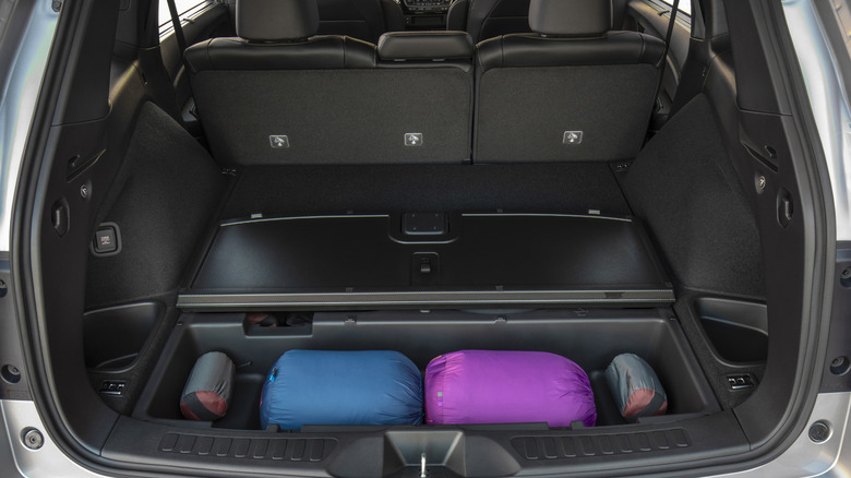 The rear cargo hold of a 2019 Honda Passport with the main floor panel lifted.