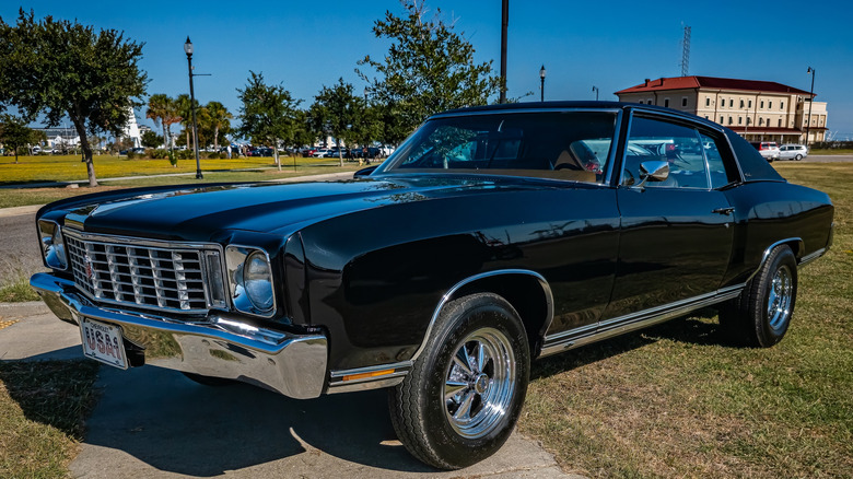 Black first-generation Chevy Monte Carlo parked outside
