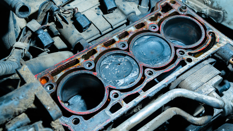Detailed image of exposed engine cylinders and pistons.