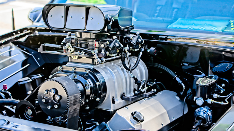 Close up of V8 engine with large supercharger.