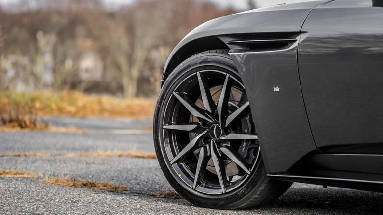 Close up of Aston Martin V12 Vantage and its wheel/tire setup.