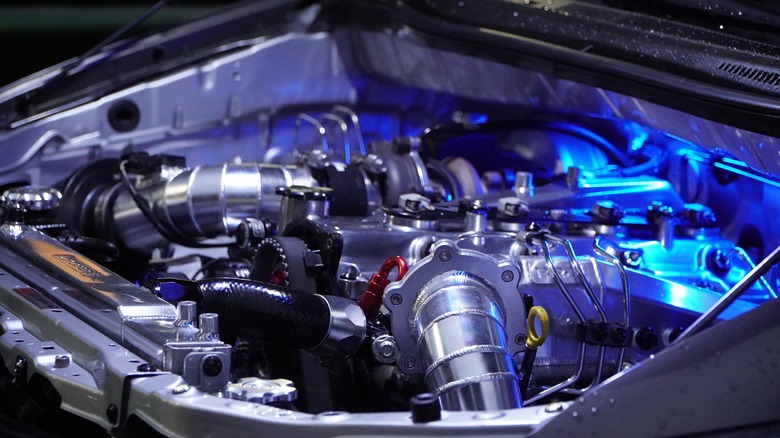 Turbocharged engine with blue accent lighting.