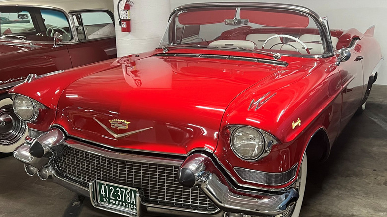 Red 1957 Cadillac Eldroado Biarritz convertible left front three-quarter view on display in the Peterson Automotive Museum