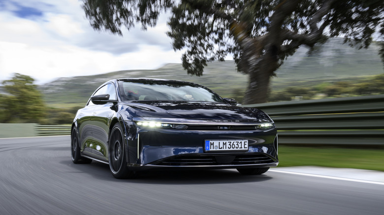 2025 Lucid Aid Sapphire cornering at speed front 3/4 view