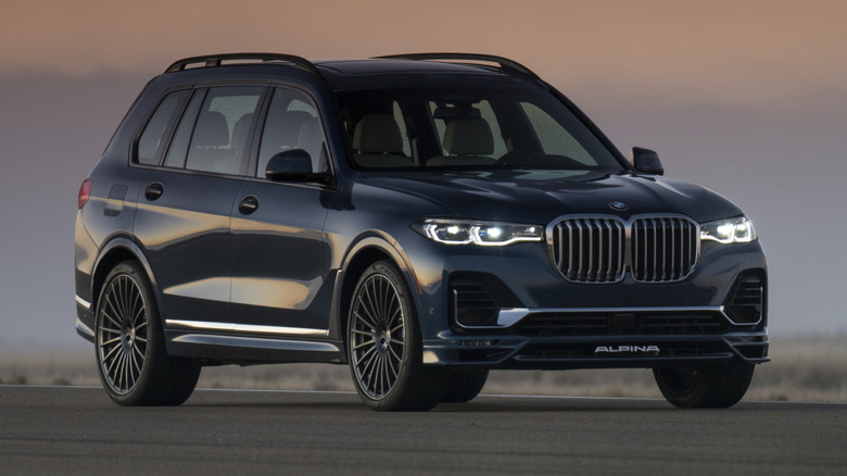 A black 2026 Alpina XB7 at sunset