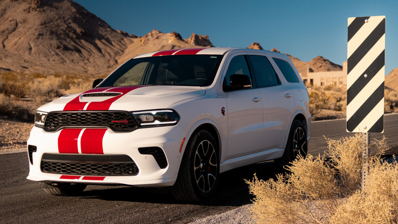 A white 2026 Dodge Durango SRT Hellcat with red striping in a desert