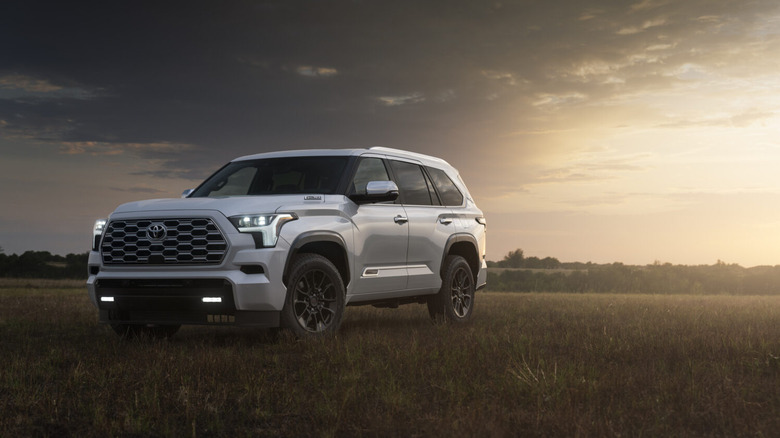A Toyota Sequoia is parked in a field.