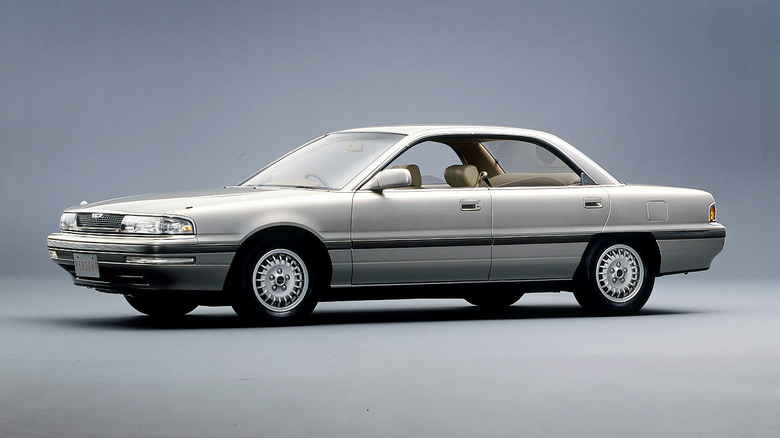 A silver Mazda Persona on display