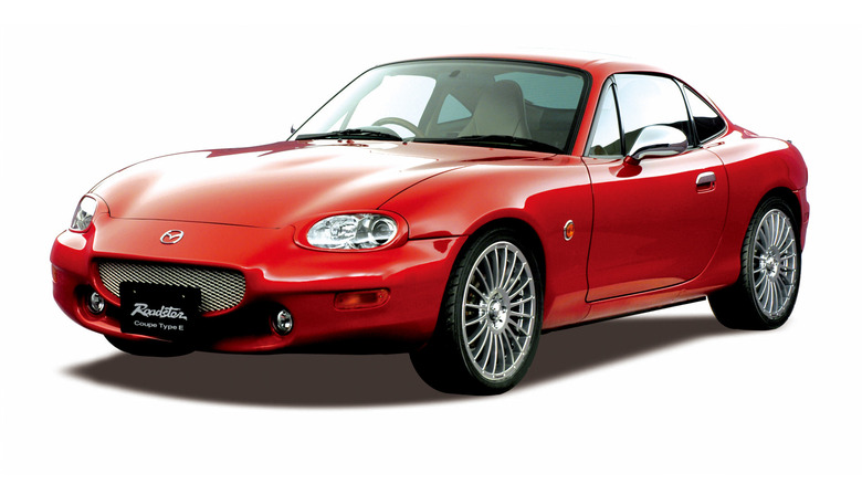 A red 2003 Mazda Roadster Coupe on display