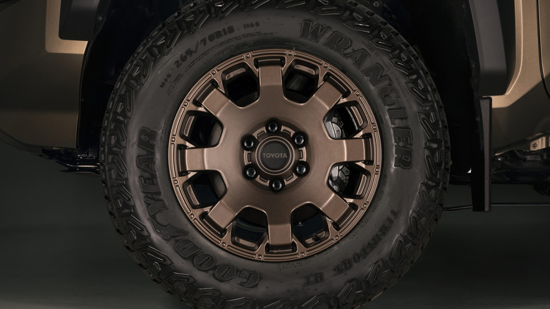 A close-up of a high-trim bronze wheel set for a Toyota Tacoma.