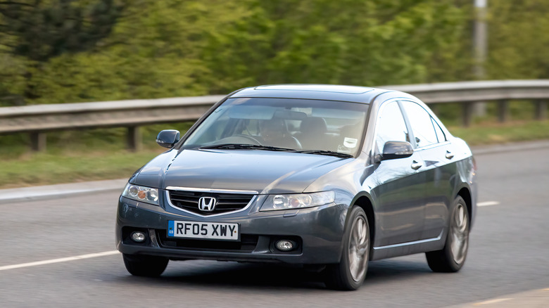 A Honda Accord drives down the road.