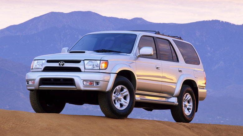 A silver third-generation Toyota 4Runner parked on a hill.