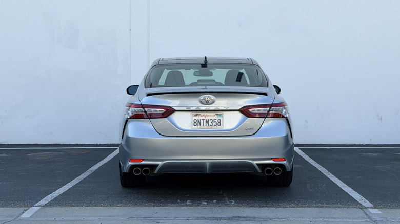 A Toyota Camry sits parked.