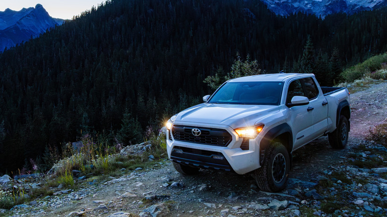 A Toyota Tacoma drives on a trail.