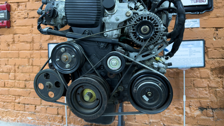 This is the front of an engine showing its pulleys and accessories.
