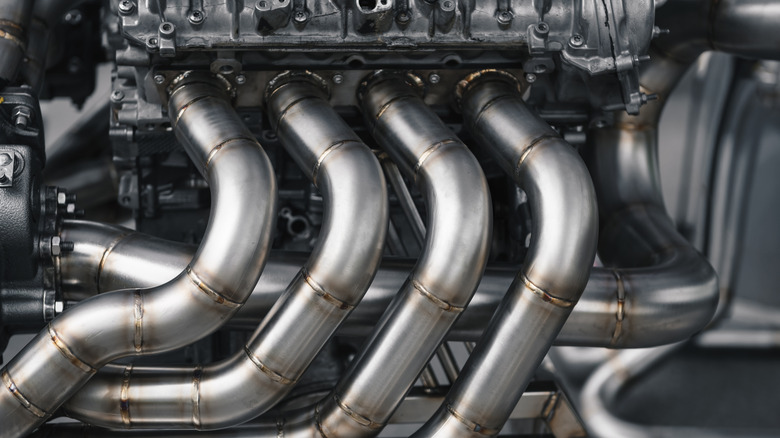 These are custom made high flow exhaust headers installed on an engine.