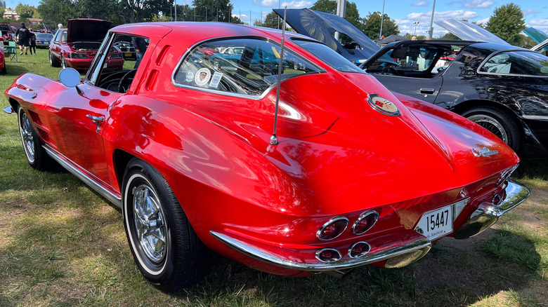 A reddish 1963 Corvette pinch nan split-window creation photographed from nan rear.