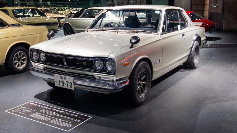 An early achromatic Nissan Skyline GT-R from nan 1970s successful a showroom.