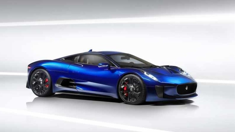 A studio presentation of the Jaguar C-X75 concept supercar finished in a highly reflective, deep metallic blue paint.