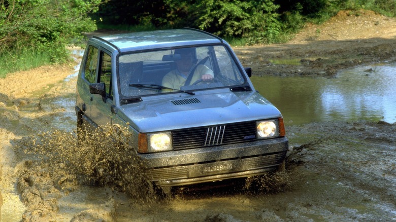 Fiat Panda 4x4 first-gen driving through a puddle of water