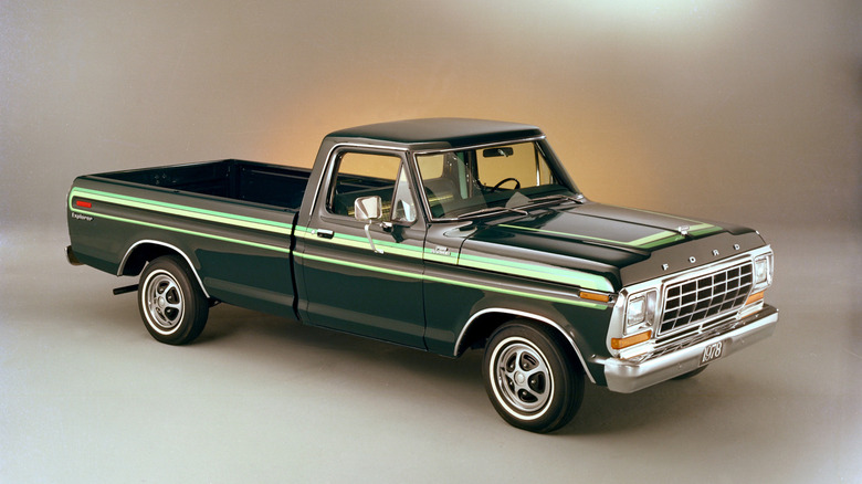 A green 1978 Ford F-100 Ranger trim in a product photo white background.