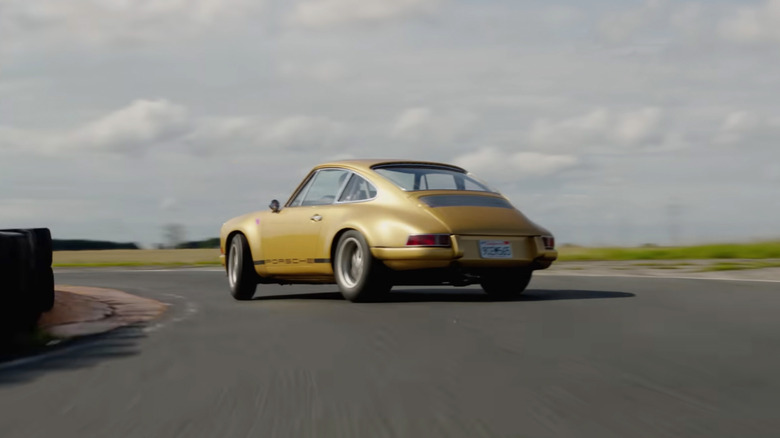 A Tuthill Porsche 911k with Swindon cylinder head drifting around a track.